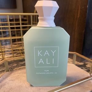 Kayali Yum Pistachio Gelato perfume. Used but has around 80-90% left of 3.4 oz